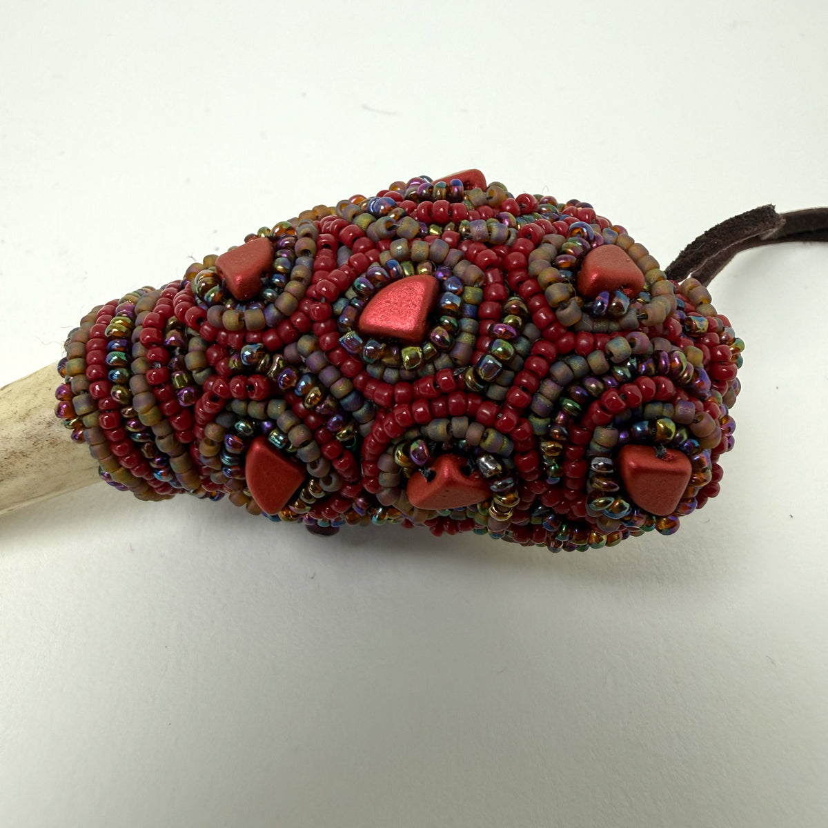 10. Carved Bone Face Talisman