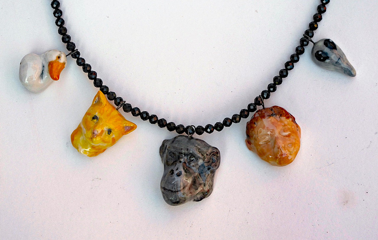 354. Heads Necklace