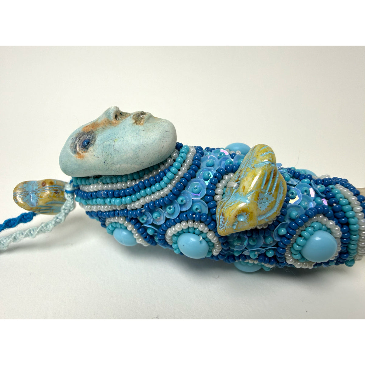 3. Blue Face with Elk Antler Talisman