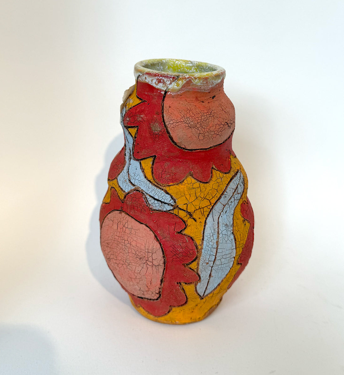 406. Orange vase, red flowers, lt turquoise leaves