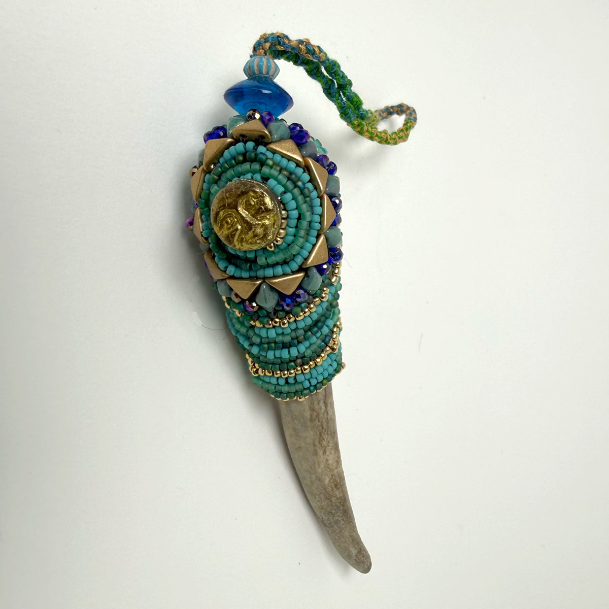 9. Turquoise w/ Sun Face Talisman